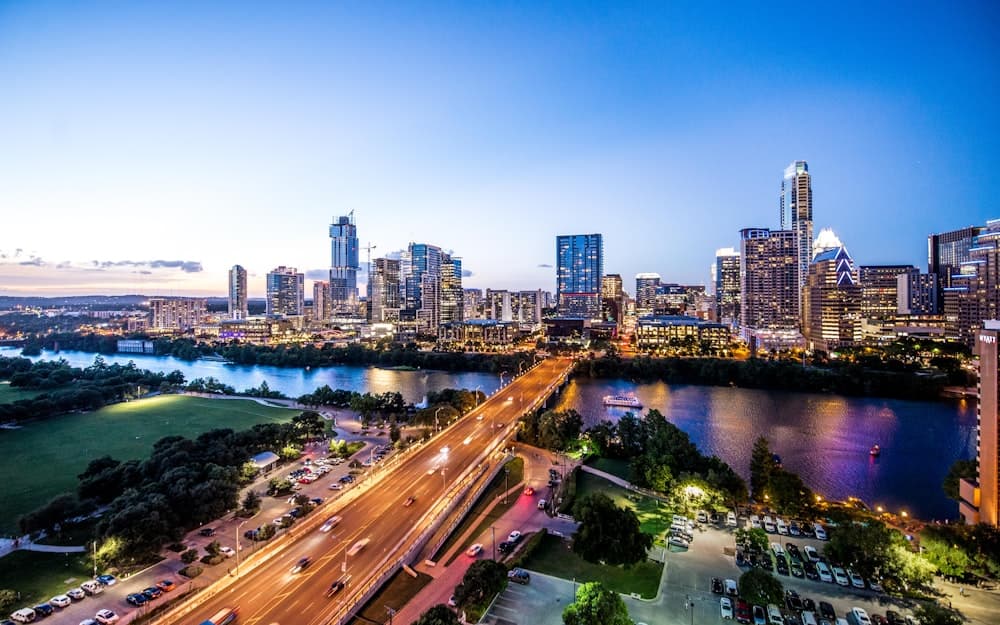 The Austin, Texas skyline at dusk over Lady Bird Lake.