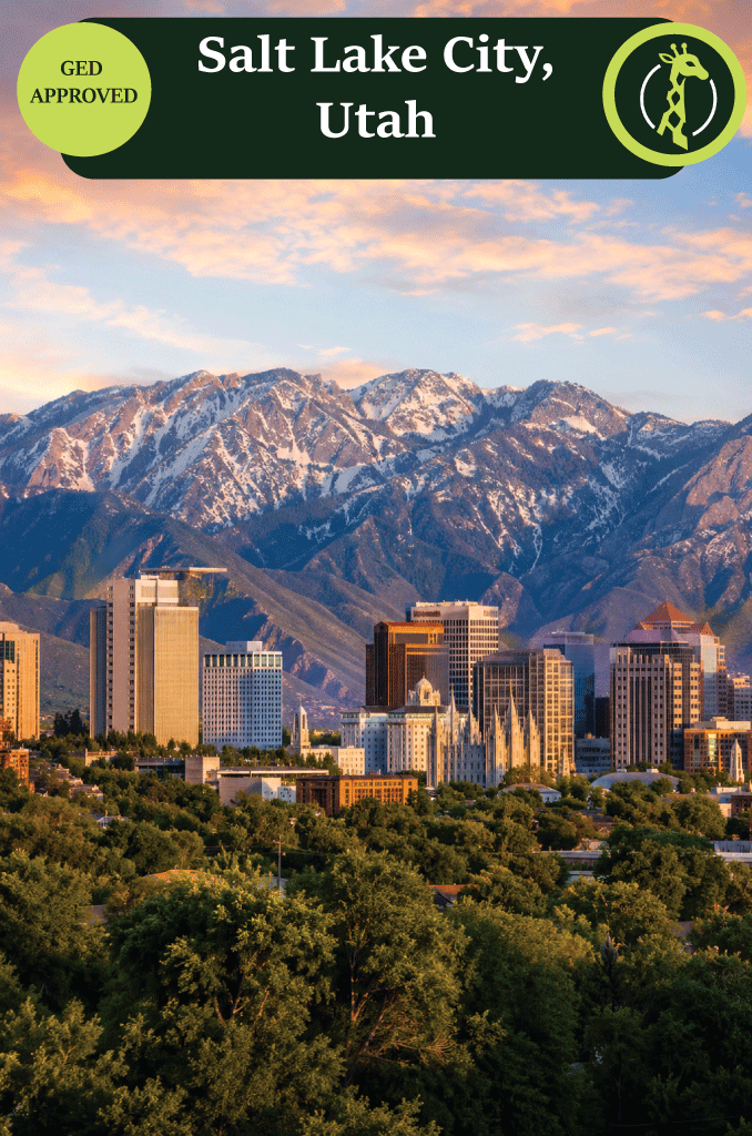 The Salt Lake City skyline with the snow-capped Wasatch Range behind it.